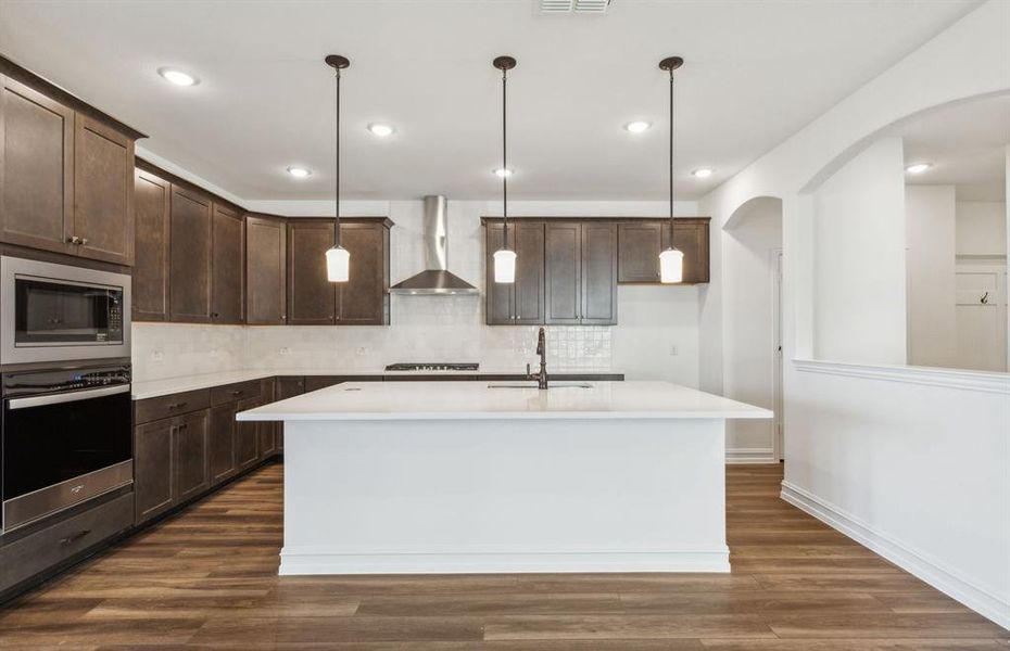 Spacious kitchen with oversized island *real home pictured