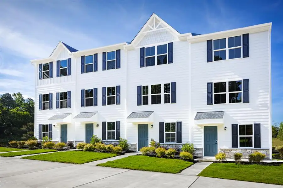Front exterior of a new home in Ashley Townhomes, Charlotte, NC, highlighting curb appeal (Image 1). Front exterior of a new home in Ashley Townhomes, Charlotte, NC, highlighting curb appeal (Image 1).