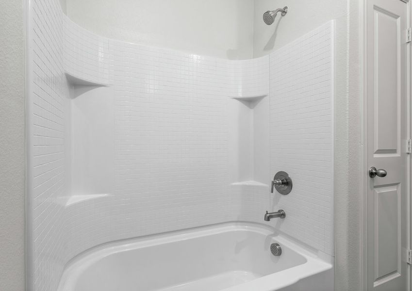 The secondary bathroom has a shower-tub combo.