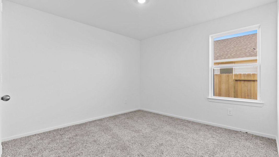 Spacious, unfurnished interior of a new home in Caldwell Crossing, Iowa Colony (Image 14).