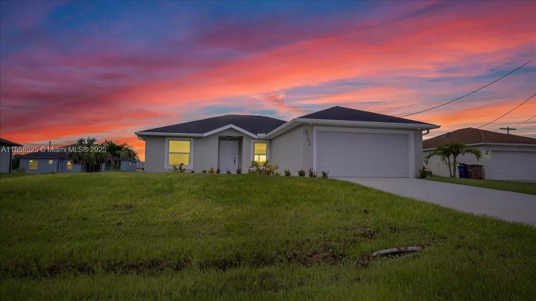 Front exterior of a new home in , Lehigh Acres, FL, highlighting curb appeal (Image 2).