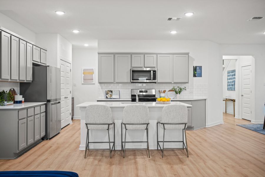 Kitchen in the Oak home plan by Trophy Signature Homes – REPRESENTATIVE PHOTO Kitchen in the Oak home plan by Trophy Signature Homes – REPRESENTATIVE PHOTO