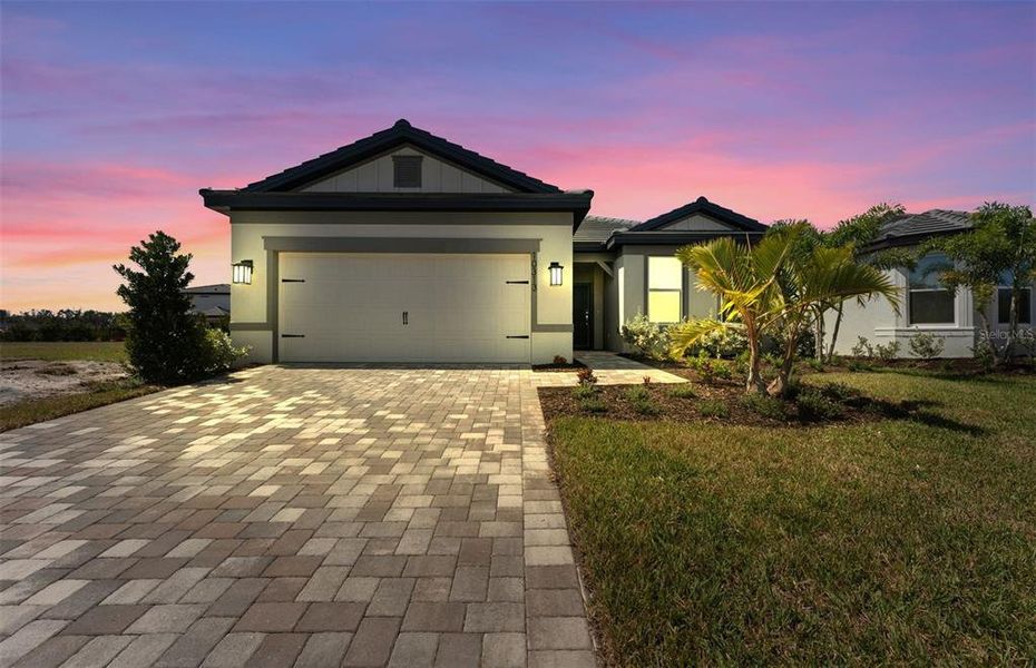Front exterior of a new home in Longmeadow at North River Ranch, Parrish, FL, highlighting curb appeal (Image 2).