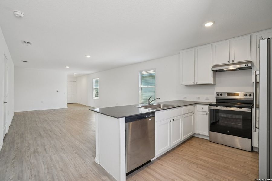 Furnished interior view inside a new home in Valle Sol, Von Ormy (Image 9).