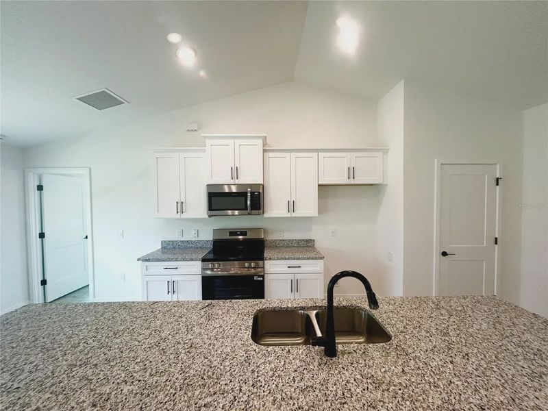 Furnished interior view inside a new home in Deep Creek, Punta Gorda (Image 6).
