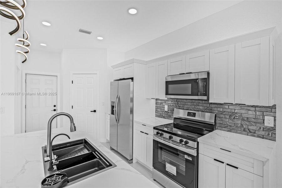 Furnished interior view inside a new home in , Cape Coral (Image 16). Furnished interior view inside a new home in , Cape Coral (Image 16).