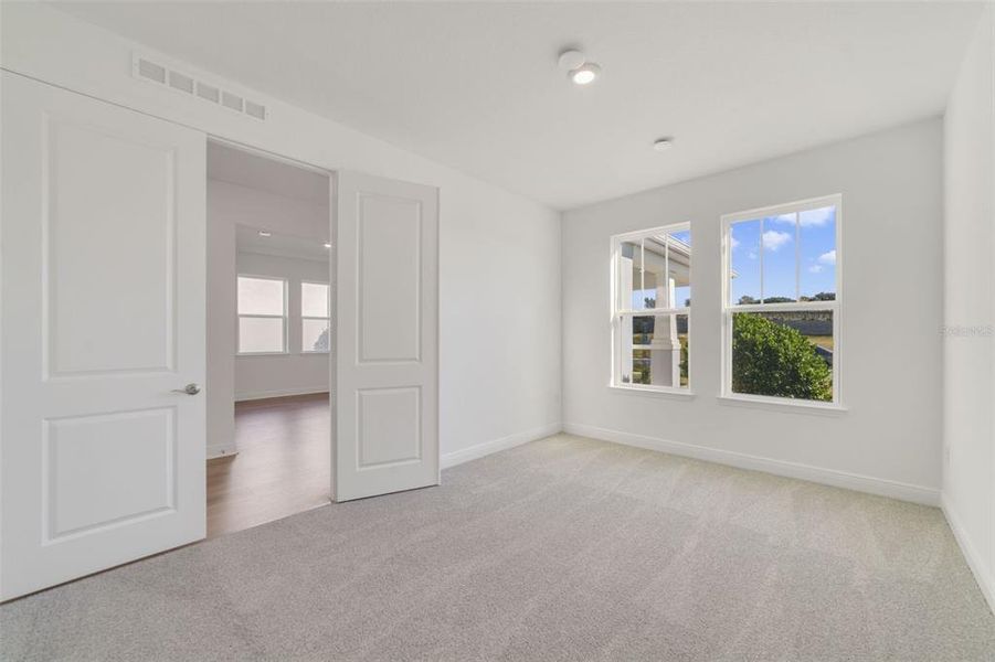 Spacious, unfurnished interior of a new home in Vintner Reserve, Clermont (Image 13).