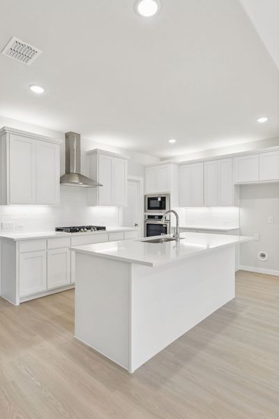 Kitchen in the Masters home plan by Trophy Signature Homes – REPRESENTATIVE PHOTO