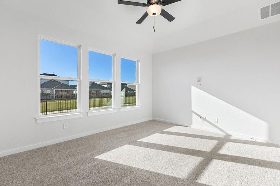 Unfurnished room with carpet and a ceiling fan Unfurnished room with carpet and a ceiling fan