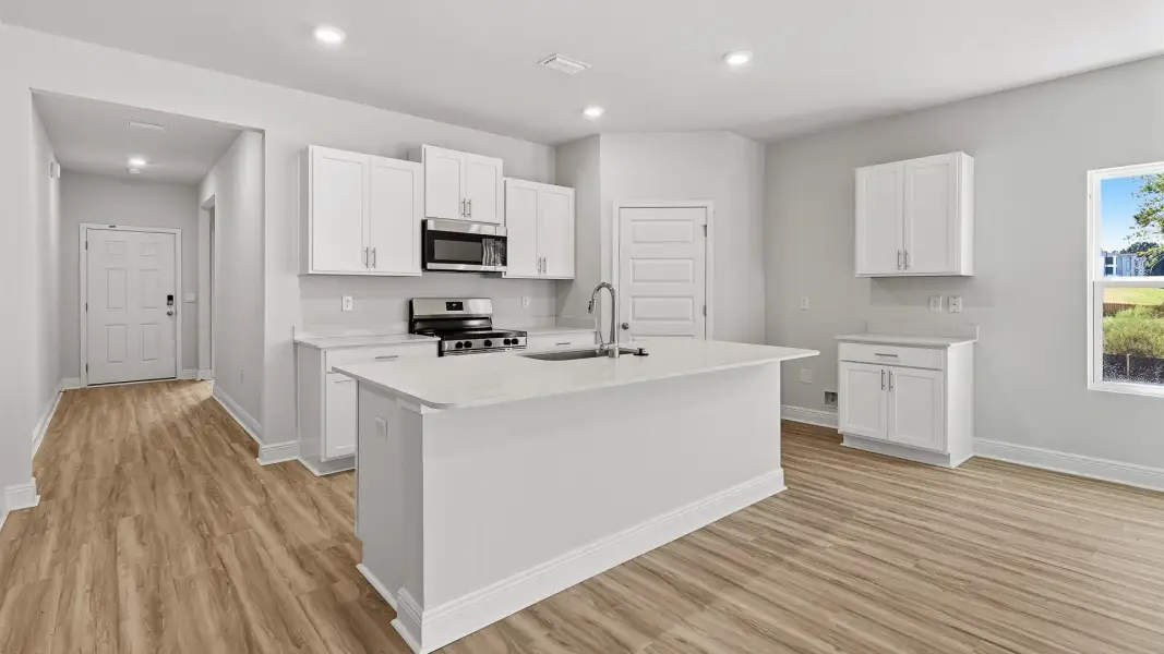 Furnished interior view inside a new home in Ashton Park Phase III, Freeport (Image 3).