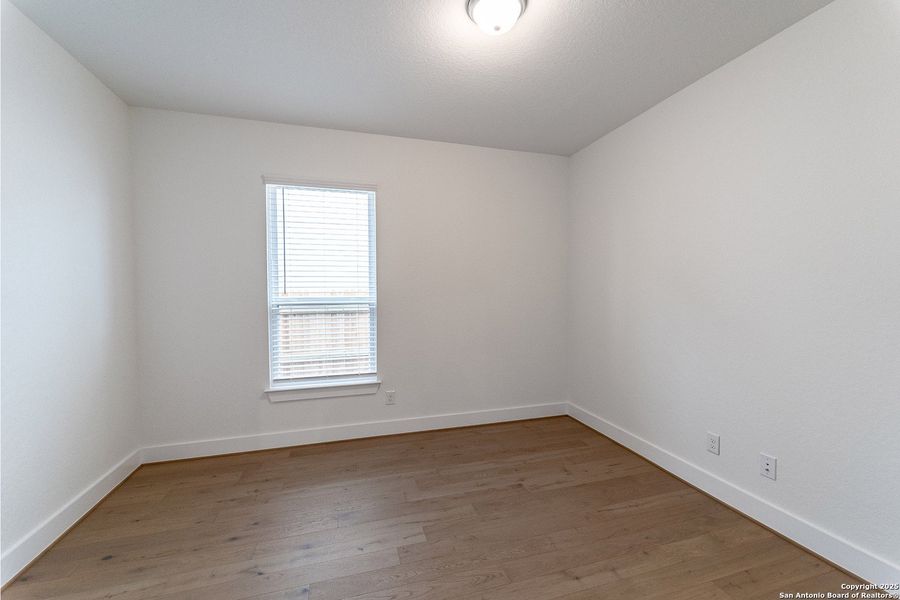 Spacious, unfurnished interior of a new home in The Woodlands at Medina Hills, Mico (Image 17).