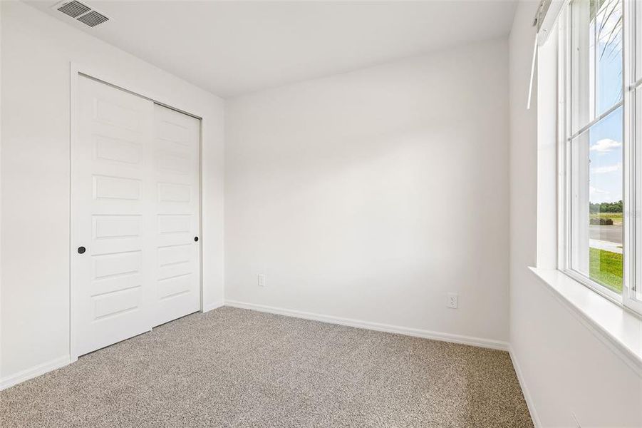 Spacious, unfurnished interior of a new home in The Grove at Stuart Crossing - Signature Series, Bartow (Image 24).
