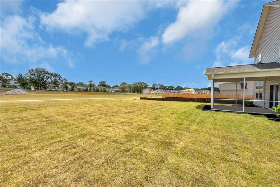 Exterior details and patio area of a home in Brownstone Park, Easley (Image 18).