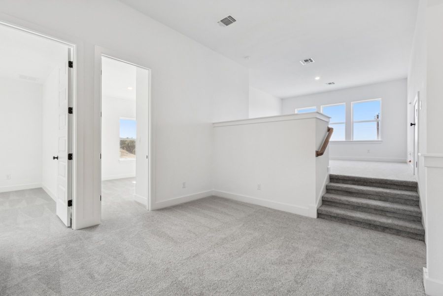 Representative unfurnished interior of a home built from the The Violet by David Weekley Homes in Headwaters 50' - Executive Series, Dripping Springs (Image 10).