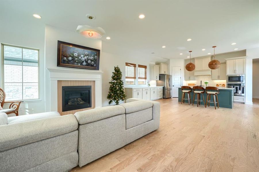 Living room with light hardwood / wood-style flooring