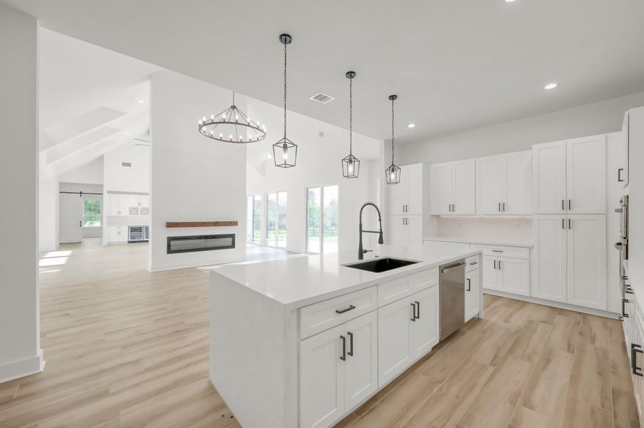 Kitchen perspective highlighting the seamless flow between cooking, dining, and living areas—perfect for entertaining and modern living.
