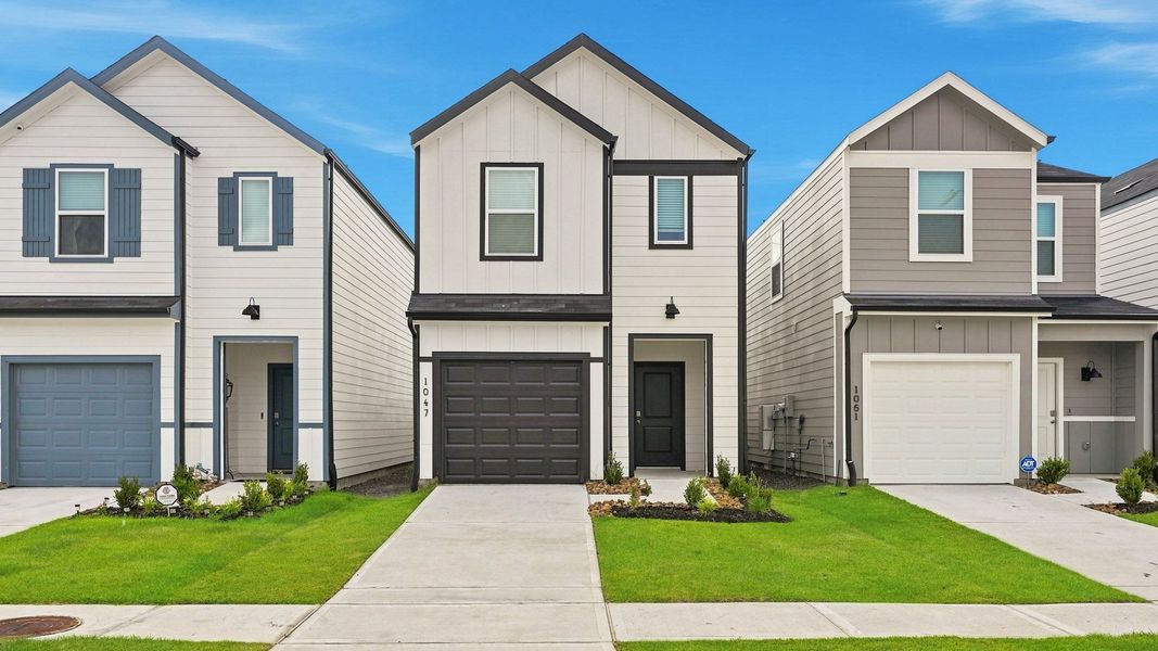 Front exterior of a new home in The Villas at Legacy Park, Houston, TX, highlighting curb appeal (Image 2). Front exterior of a new home in The Villas at Legacy Park, Houston, TX, highlighting curb appeal (Image 2).