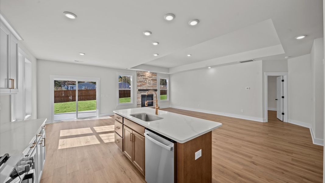 Well-designed kitchen with a center island and tasteful finishes that elevate everyday living Well-designed kitchen with a center island and tasteful finishes that elevate everyday living