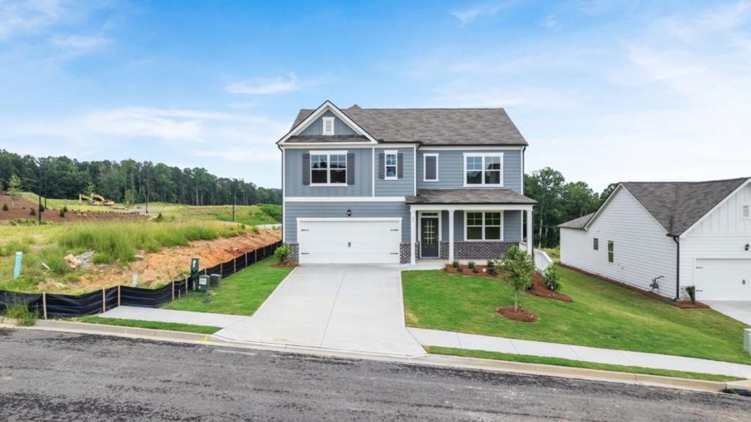 Front exterior of a new home in Sheffield Highlands, Dallas, GA, highlighting curb appeal (Image 2). Front exterior of a new home in Sheffield Highlands, Dallas, GA, highlighting curb appeal (Image 2).