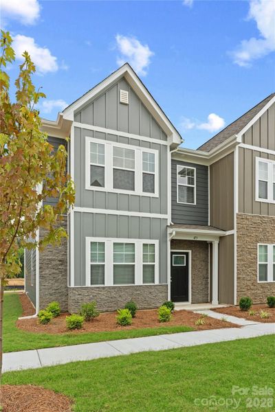 Front exterior of a new home in Sierra Ridge, Gastonia, NC, highlighting curb appeal (Image 2). Front exterior of a new home in Sierra Ridge, Gastonia, NC, highlighting curb appeal (Image 2).
