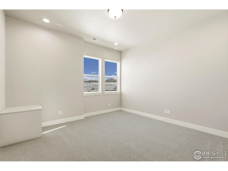 Spacious, unfurnished interior of a new home in The Fairways at RainDance, Windsor (Image 18).