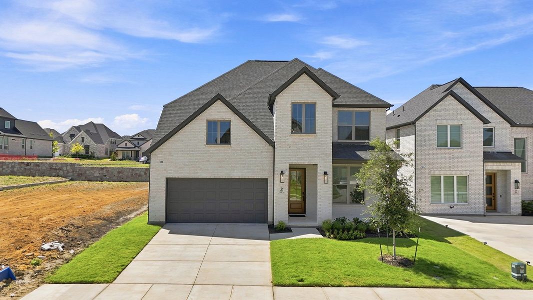 Front exterior of a new home in Hillside Village, Celina, TX, highlighting curb appeal (Image 2). Front exterior of a new home in Hillside Village, Celina, TX, highlighting curb appeal (Image 2).