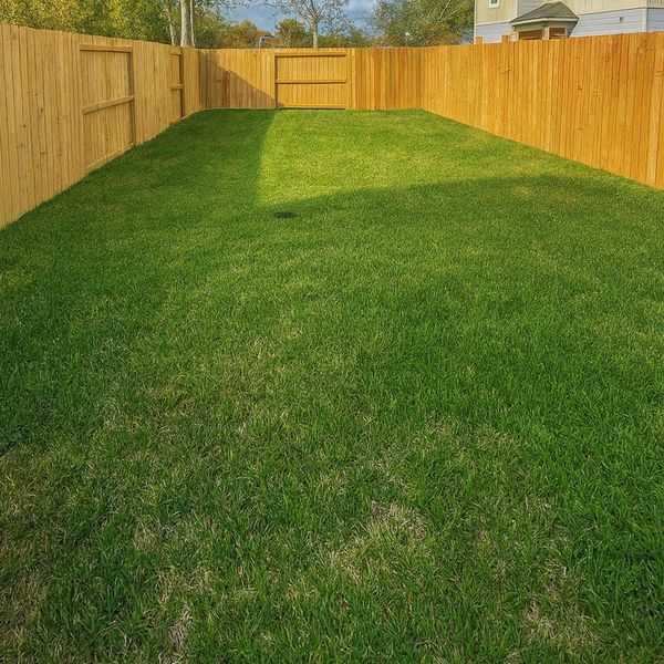 This large backyard is completely fenced in. There’s room for the dog to run around, with plenty of space to lounge, host BBQ, and entertain.
