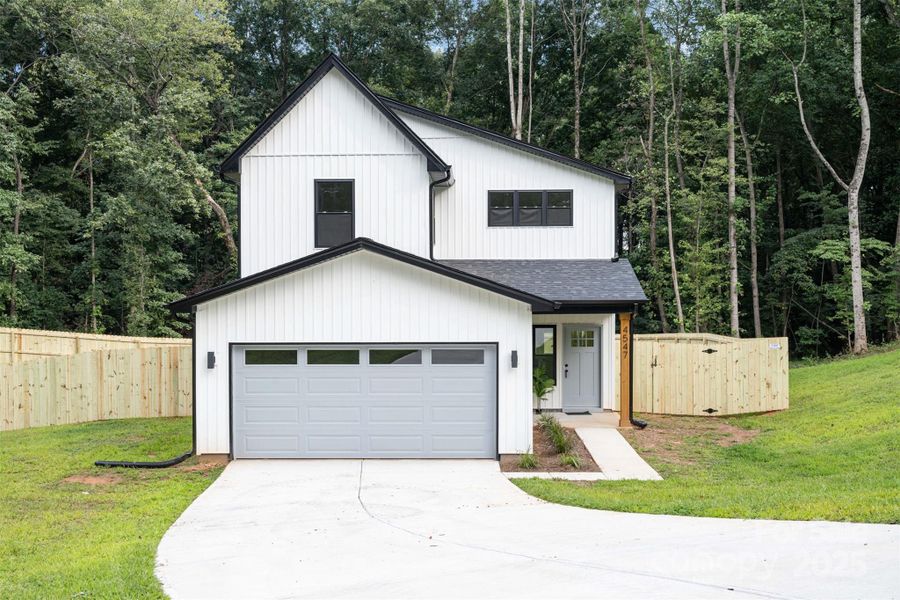 Front exterior of a new home in , Hickory, NC, highlighting curb appeal (Image 26).