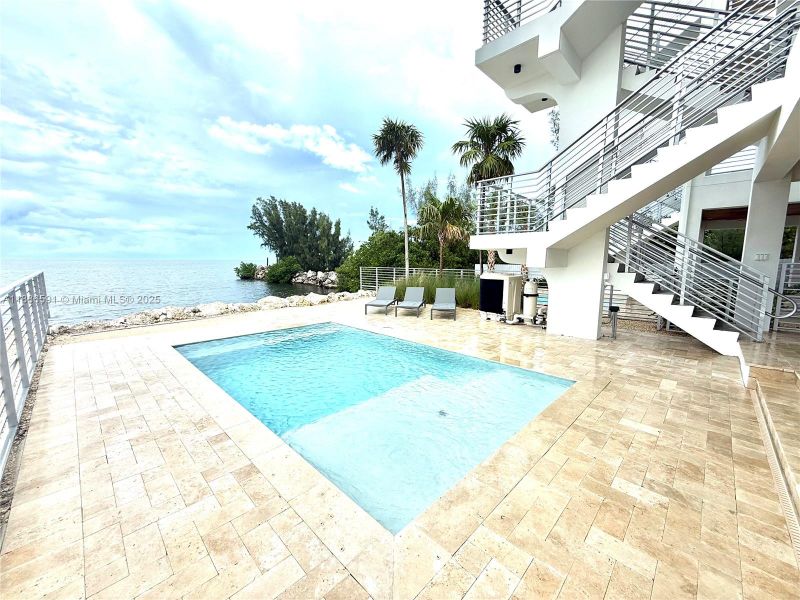 Exterior details and patio area of a home in , Marathon (Image 24). Exterior details and patio area of a home in , Marathon (Image 24).
