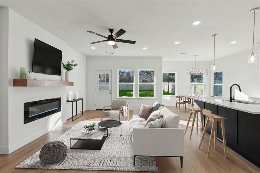 Living room featuring open floor plan with tons of natrual lighting