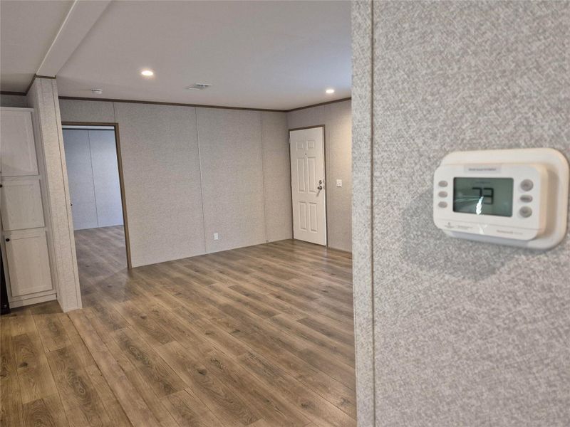 Spare room featuring wood finished floors and recessed lighting