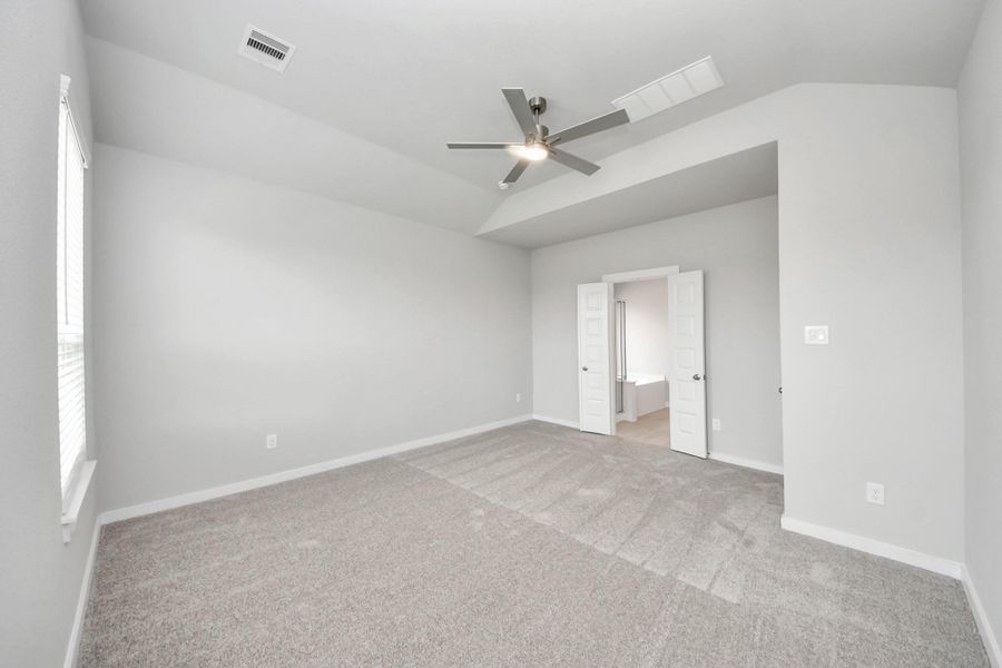 Come and unwind after a long day in this magnificent primary suite! This spacious room features plush carpet, warm paint, high ceilings and large windows with privacy blinds. Sample photo of completed home with similar floor plan. Actual colors and selections may vary. Come and unwind after a long day in this magnificent primary suite! This spacious room features plush carpet, warm paint, high ceilings and large windows with privacy blinds. Sample photo of completed home with similar floor plan. Actual colors and selections may vary.