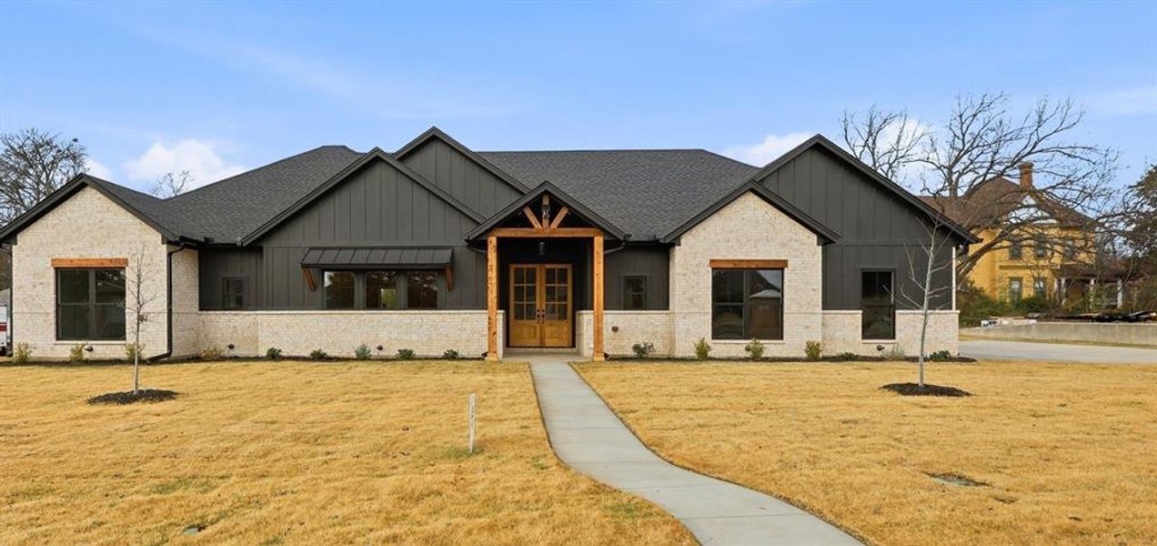 Front exterior of a new home in , Grandview, TX, highlighting curb appeal (Image 22). Front exterior of a new home in , Grandview, TX, highlighting curb appeal (Image 22).