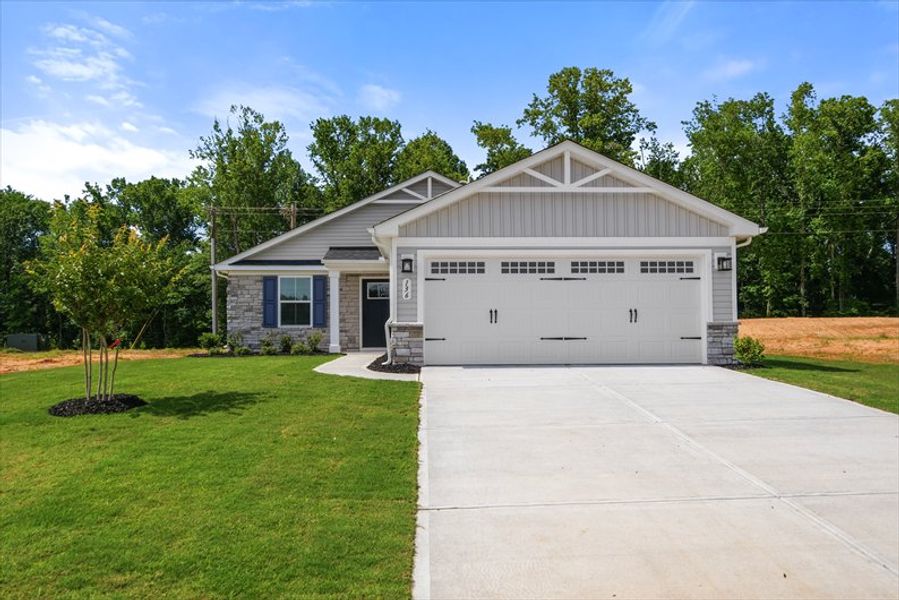 Front exterior of a new home in Wren Woods Ranches, Gray Court, SC, highlighting curb appeal (Image 1). Front exterior of a new home in Wren Woods Ranches, Gray Court, SC, highlighting curb appeal (Image 1).