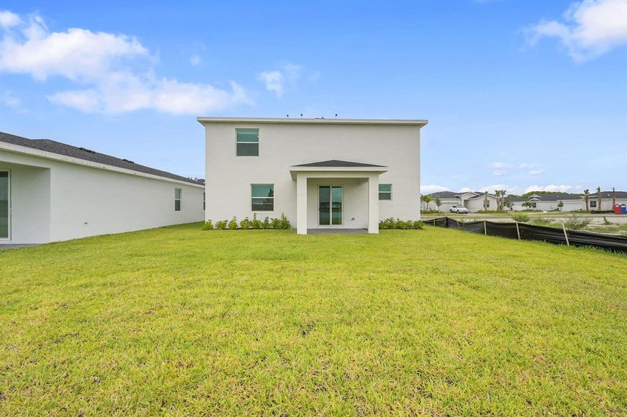 Front exterior of a new home in Seagrove: The Indies, Fort Pierce, FL, highlighting curb appeal (Image 2).