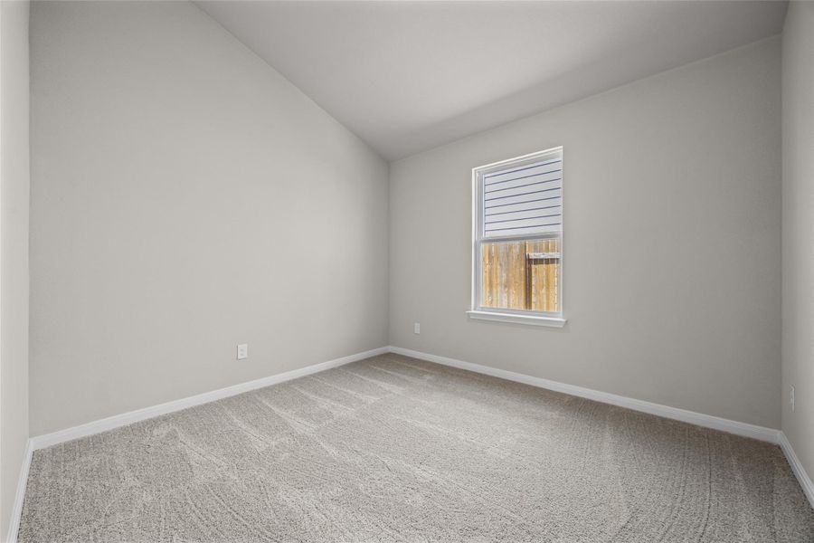 A vaulted ceiling and soft carpeting enhance the cozy feel of this bedroom. A vaulted ceiling and soft carpeting enhance the cozy feel of this bedroom.
