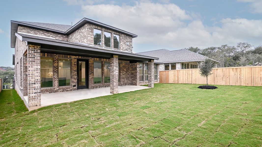 Exterior details and patio area of a home in Hidden Canyon 55', San Antonio (Image 2).