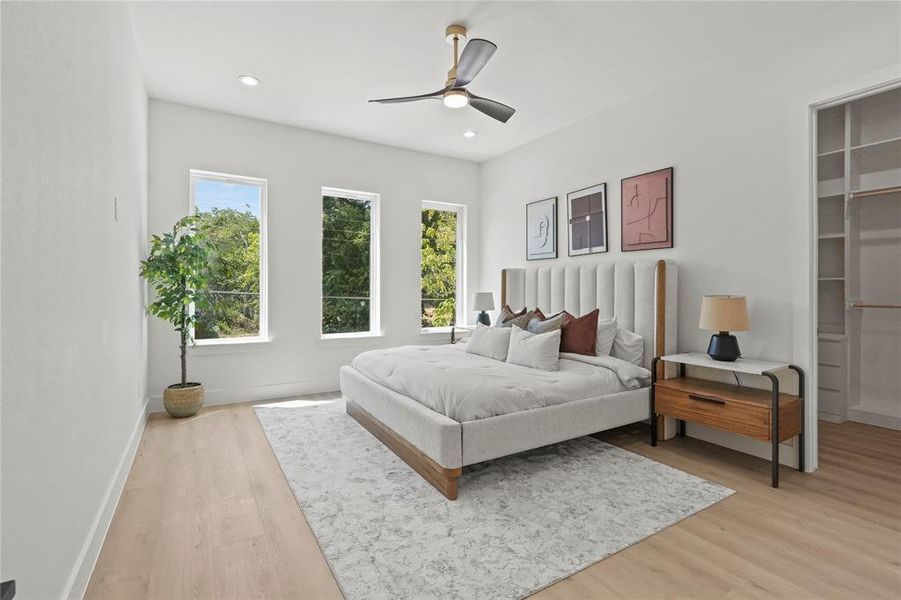 Bedroom featuring ceiling fan and light wood-type flooring