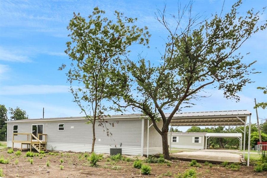 Front exterior of a new home in , Coleman, TX, highlighting curb appeal (Image 12).