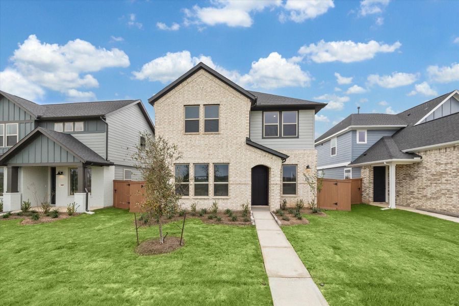 Front exterior of a new home in Elyson, Katy, TX, highlighting curb appeal (Image 21).
