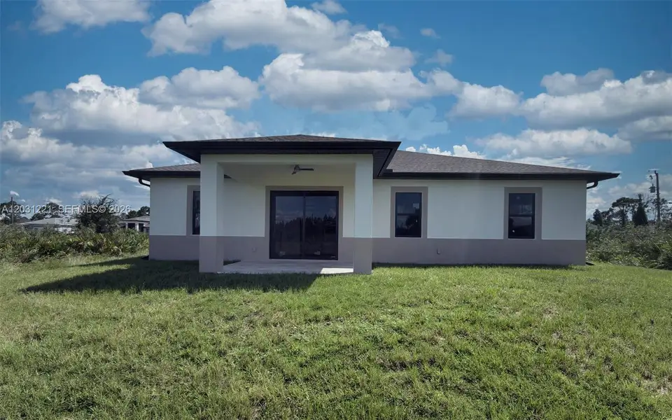 Exterior details and patio area of a home in , Lehigh Acres (Image 3).