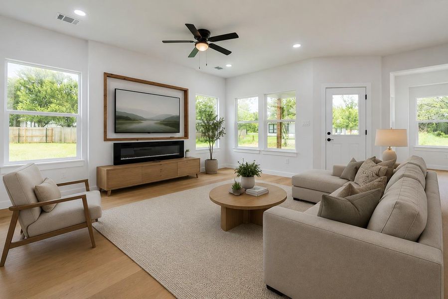Virtually staged,  spacious living room featuring gleaming hardwood floors and an electric modern fireplace.