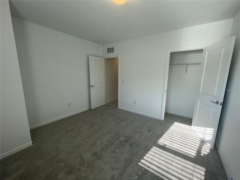 Spacious, unfurnished interior of a new home in Isles at BayView, Parrish (Image 22).