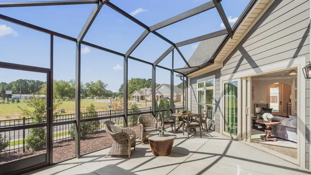 Exterior details and patio area of a home in Courtyards by Carrell, Ocean Isle Beach (Image 2). Exterior details and patio area of a home in Courtyards by Carrell, Ocean Isle Beach (Image 2).