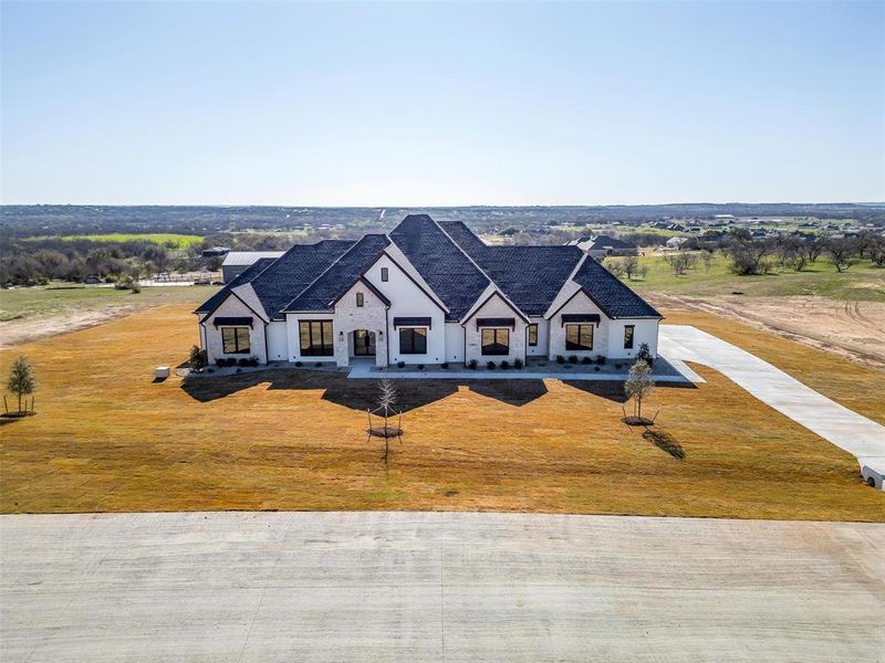 Front exterior of a new home in , Weatherford, TX, highlighting curb appeal (Image 2). Front exterior of a new home in , Weatherford, TX, highlighting curb appeal (Image 2).