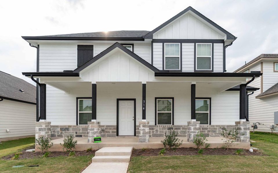 Front exterior of a new home in Brooklands, Hutto, TX, highlighting curb appeal (Image 1). Front exterior of a new home in Brooklands, Hutto, TX, highlighting curb appeal (Image 1).