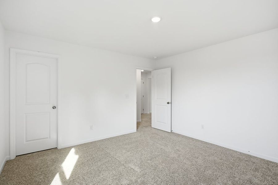 A hallway with white doors. A hallway with white doors.