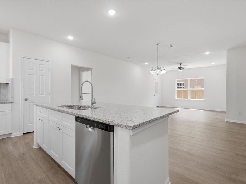 Designed for both connection and comfort, the seamless transition from the kitchen to the living space makes gathering and entertaining feel effortless. Designed for both connection and comfort, the seamless transition from the kitchen to the living space makes gathering and entertaining feel effortless.