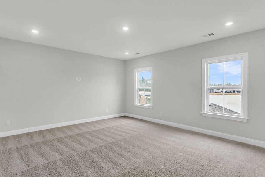 Spacious, unfurnished interior of a new home in Tidewater at Lakes of Cane Bay, Summerville (Image 23).