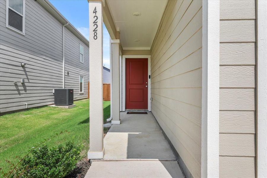 Exterior details and patio area of a home in Foree Ranch: Wellton Collection, Providence Village (Image 22).